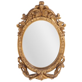 AN EARLY 19TH CENTURY CARVED GILTWOOD FRAMED MIRROR.