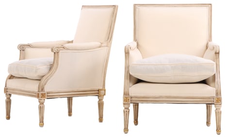 A PAIR OF FRENCH LOUIS XVI STYLE PAINTED AND GILT WOOD BERGERE CHAIRS HAVING RECENT FABRIC CIRCA