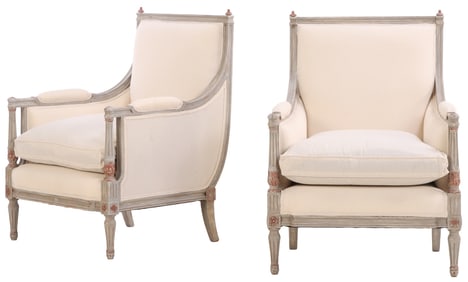 A PAIR OF GREY PAINTED AND PARTIAL GILT WOOD LOUIS XVI STYLE UPHOLSTERED BERGERE CHAIRS CIRCA 1940