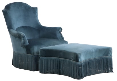 A NAPOLEON III LOUNGE CHAIR HAVING A CONFORMING OTTOMAN, BOTH WITH FRINGE DECORATION.