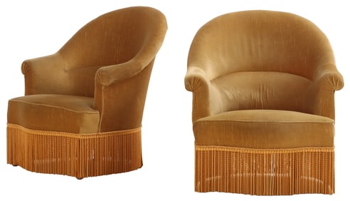 TWO OF FOUR NAPOLEON III STYLE UPHOLSTERED LOUNGE CHAIRS WITH FRINGE DECORATION.