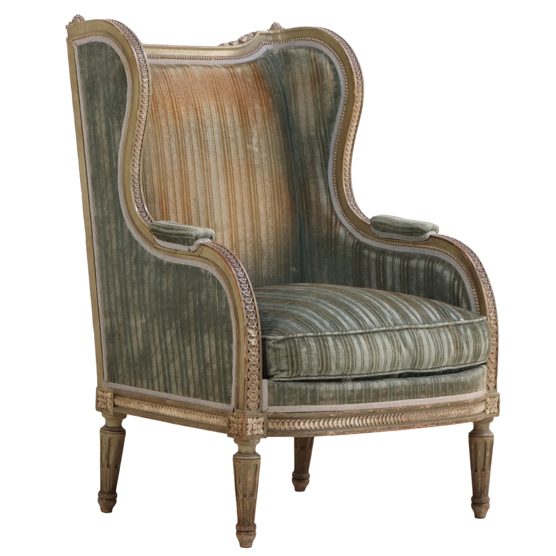A PAINTED AND CARVED FRENCH LOUIS XVI STYLE UPHOLSTERED BERGERE CHAIR CIRCA 1900.: A painted and carved French Louis XVI style upholstered Bergere chair circa 1900. Ht: 40.5" Wd: 28.5" Dpth: 28.5" Seat: 20"