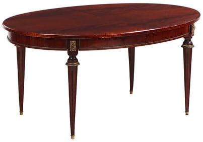 A FRENCH CROTCH MAHOGANY OVAL BRONZE MOUNTED LOUIS XVI STYLE DINING ROOM TABLE HAVING TWO MAHOGANY