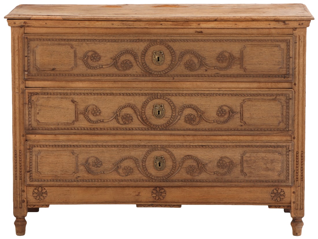 THREE DRAWER CARVED OAK BELGIAN COMMODE HAVING CARVED DRAWER FRONTS CIRCA 1820.: Three drawer carved oak Belgian commode having carved drawer fronts circa 1820. Ht: 36.5" Wd: 50" Dpth: 21.25"