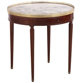 A FRENCH LOUIS XVI STYLE BOUILLOT TABLE HAVING TWO DRAWERS, TWO PULL OUT SLIDES AND A BRASS BOUND