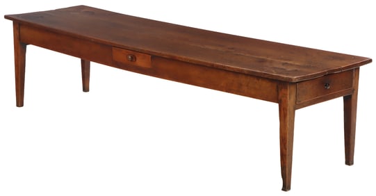 A LARGE FRENCH FARM TABLE HAVING SQUARE TAPERED LEGS AND MULTIPLE DRAWERS CIRCA 1810.