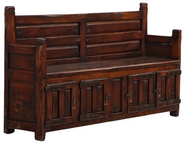 AN EIGHTEENTH CENTURY WALNUT LIFT LID BENCH HAVING PANELED DESIGN AND IRON STRAP HINGES.