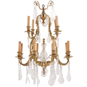 TWELVE ARM BRASS AND CRYSTAL CHANDELIER IN THE LOUIS XV STYLE.