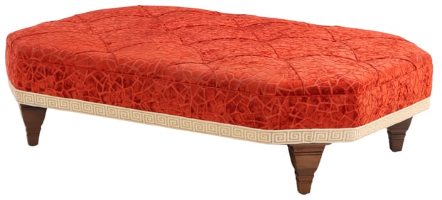 LARGE UPHOLSTERED OTTOMAN C 1960 HAVING WALNUT FEET.
