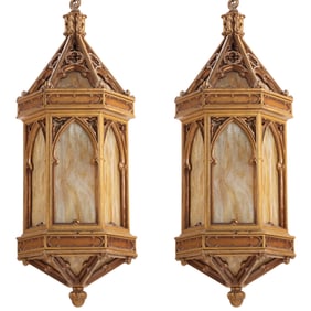 A PAIR OF ANTIQUE GOTHIC STYLE HANGING BRONZE PAINTED LANTERNS HAVING SLAG GLASS INSERTS