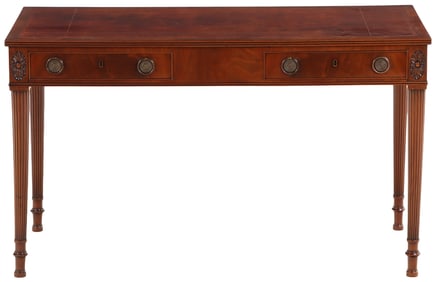 A CABINET MADE MAHOGANY LEATHER TOP WRITING DESK HAVING TWO DRAWERS, OVAL CARVED ROSETTES AND