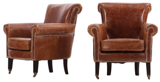 A STYLISH PAIR OF MODERN FRENCH LEATHER CLUB CHAIRS HAVING METAL TACK UPHOLSTERY AND EBONIZED