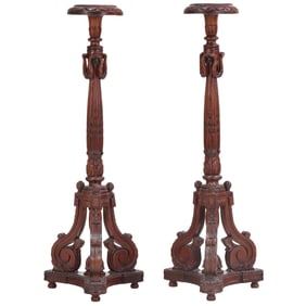 A PAIR OF REGENCY STYLE CARVED SOLID MAHOGANY TORCHIERES HAVING SWAG DECORATIONS