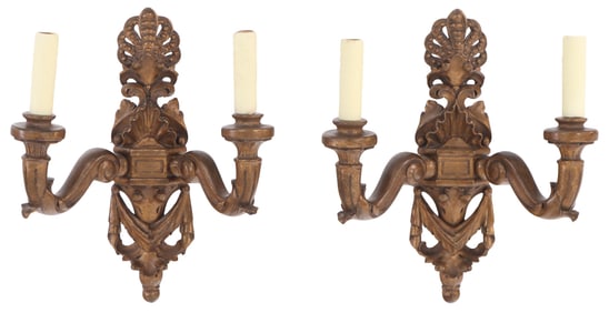 A PAIR OF ITALIAN ROCOCO STYLE CARVED GILTWOOD TWO-ARM WALL SCONCES HAVING SHELL MOTIF, EARLY