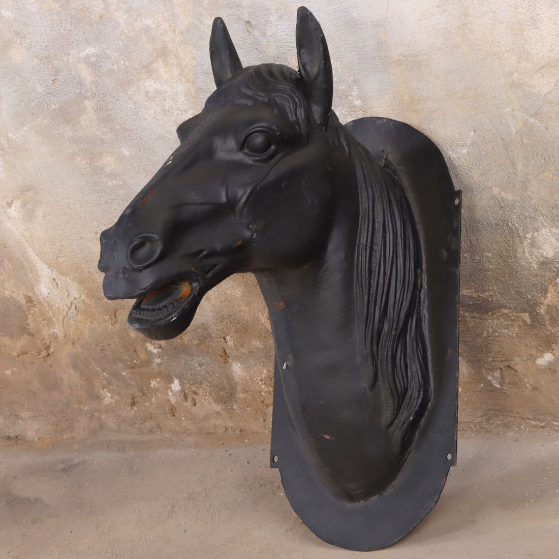 A PAINTED CAST IRON WALL MOUNTED HORSE HEAD FOR YOUR BARN OR OFFICE.: A painted cast iron wall mounted horse head for your barn or office. Ht: 28.5" Wd: 14" Dpth: 22"