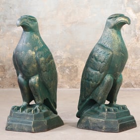 A LARGE PAIR OF PAINTED CAST IRON PERCHED EAGLES.