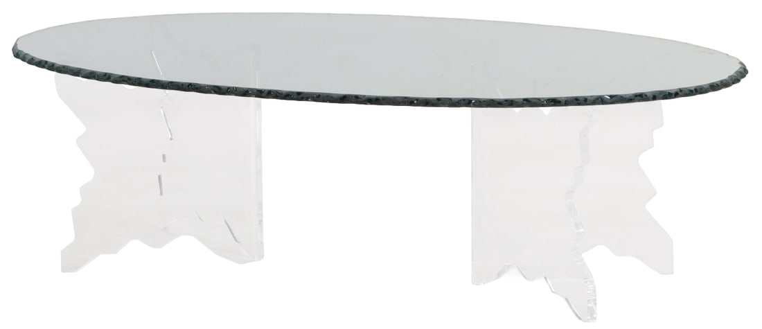 A GLASS TOP COFFEE TABLE RESTING ON LUCITE PEDESTALS C 1985. (1 of 6)