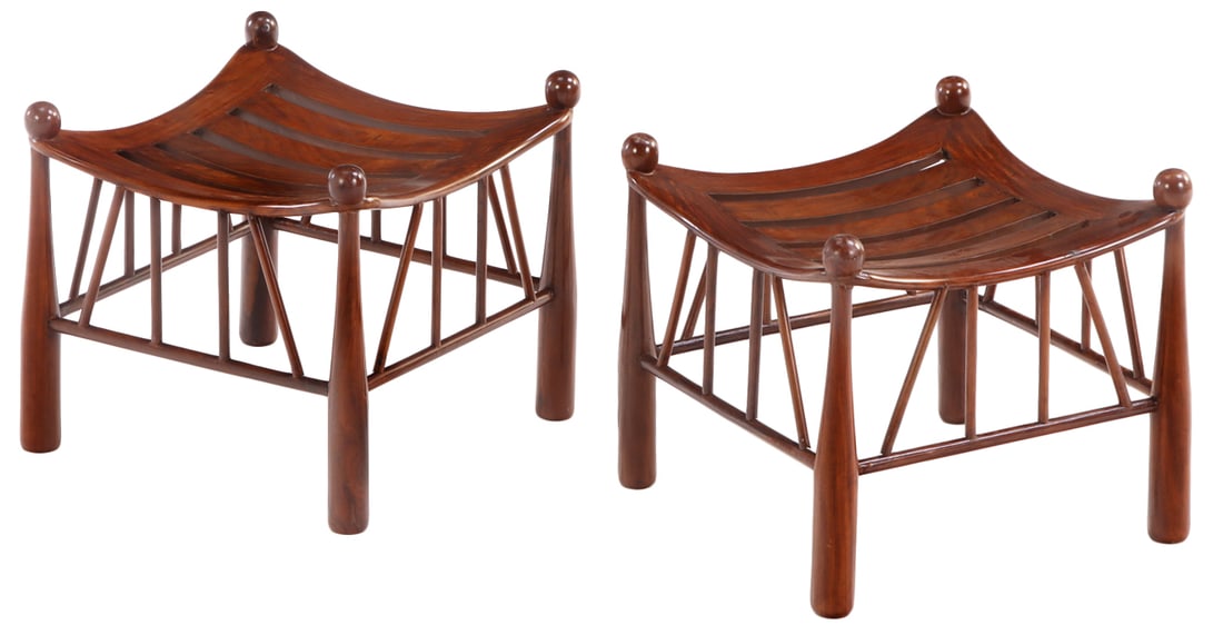 UNUSUAL PAIR OF FIGURED MAHOGANY THEBES STOOLS HAVING SHAPED OPEN WORK SEATS. (1 of 4)