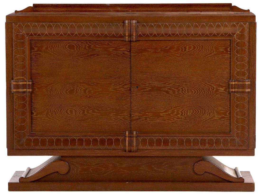 FRENCH CERUSED OAK TWO DOOR BAR CABINET C 1940 HAVING AN INTRICATE PULL OUT PAINTED BAR INTERIOR: French cerused oak two door bar cabinet C 1940 having an intricate pull out painted bar interior with painted glass and drawers. Ht: 41" Wd: 55" Dpth: 19.5"