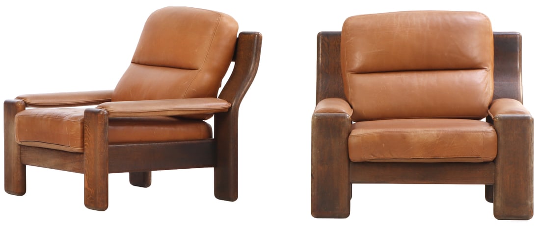 PAIR OF FRENCH OAK AND LEATHER LOUNGE CHAIRS C 1965.: Pair of French oak and leather lounge chairs C 1965. Ht: 33.5" Wd: 37" Dpth: 36" Seat: 15"