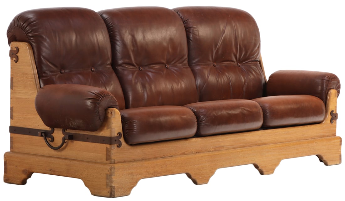 FRENCH SOLID OAK BRUTALIST STYLE SOFA WITH IRON ORNAMENT AND LEATHER CUSHIONS C 1960.: French solid oak Brutalist style sofa with iron ornament and leather cushions C 1960. Ht: 39" Wd: 90" Dpth: 37" Seat: 18.5"