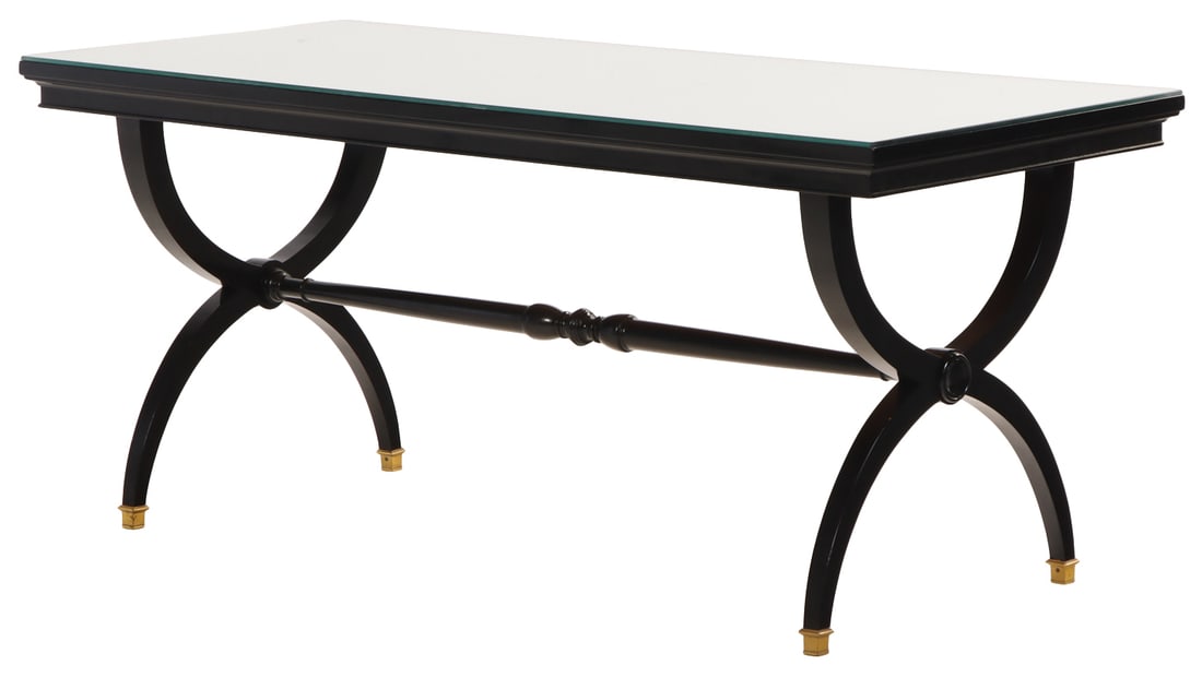 A HOLLYWOOD REGENCY STYLE EBONIZED COFFEE TABLE HAVING A MIRRORED TOP C 1940.: A Hollywood Regency style ebonized coffee table having a mirrored top C 1940. Ht: 24" Wd: 55" Dpth: 23.5"