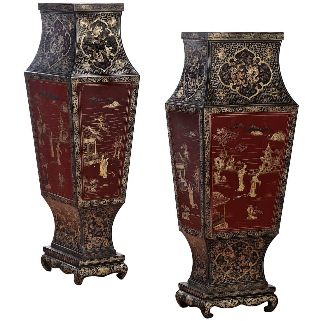 A PAIR OF ASIAN INSPIRED INTRICATELY DECORATED WOOD PEDESTALS RESTING ON SMALL PLINTH BASES.: A pair of Asian inspired intricately decorated wood pedestals resting on small plinth bases. Ht: 73" Wd: 28.5" Dpth: 20.75"
