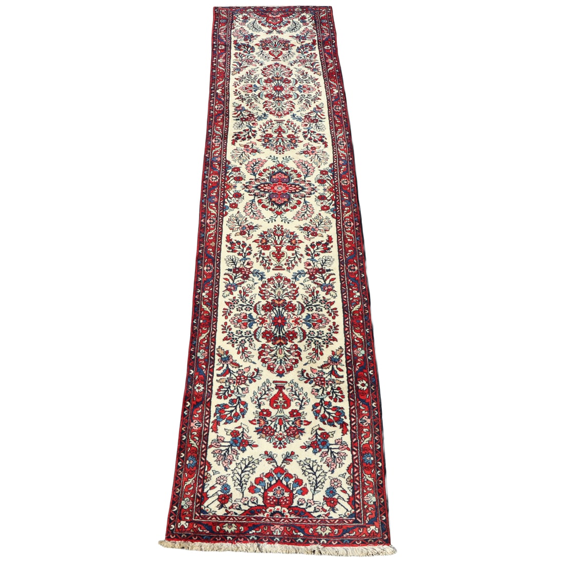 A PERSIAN SAROUK RUNNER RUG 13' 2" X 2' 7": A Persian Sarouk runner rug 13' 2" x 2' 7"