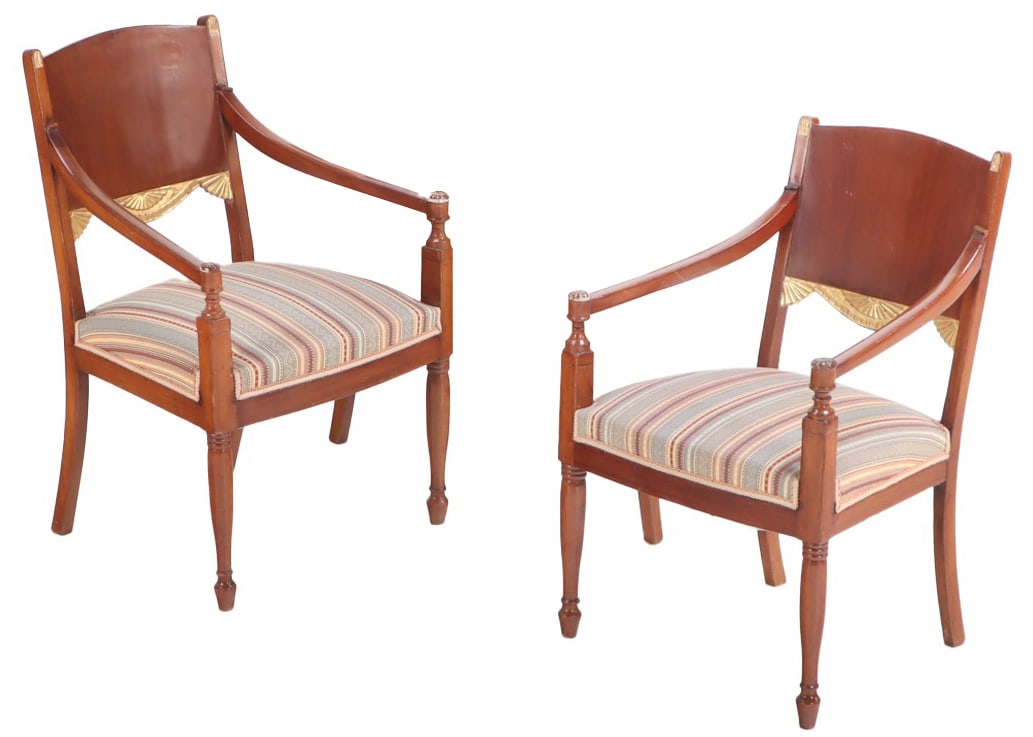 A PAIR OF RUSSIAN STYLE MAHOGANY AND GILT CARVED OPEN ARMCHAIRS CIRCA 1920.: A pair of Russian style mahogany and gilt carved open armchairs circa 1920. Ht: 32" Wd: 21.5" Dpth: 23" Seat: 18"