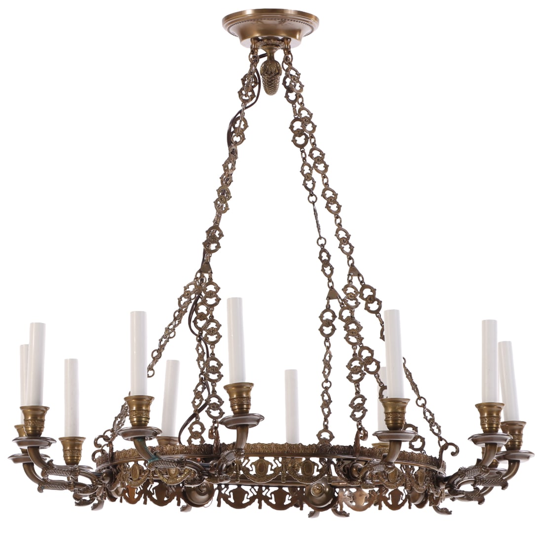 A FRENCH BRASS TWELVE ARM CHANDELIER HAVING RIBBON AND SWAG MOTIFS.: A French brass twelve arm chandelier having ribbon and swag motifs. Ht: 29" Wd: 30" Dpth: 30"