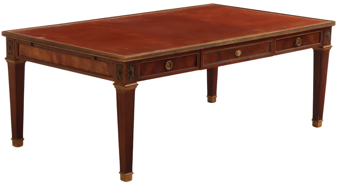 EXECUTIVE SIZE MAHOGANY BRONZE MOUNTED WRITING DESK C 1910 HAVING S GILT EMBOSSED LEATHER TOP,: Executive size mahogany bronze mounted writing desk C 1910 having s gilt embossed leather top, three drawers and a pull out slide.
