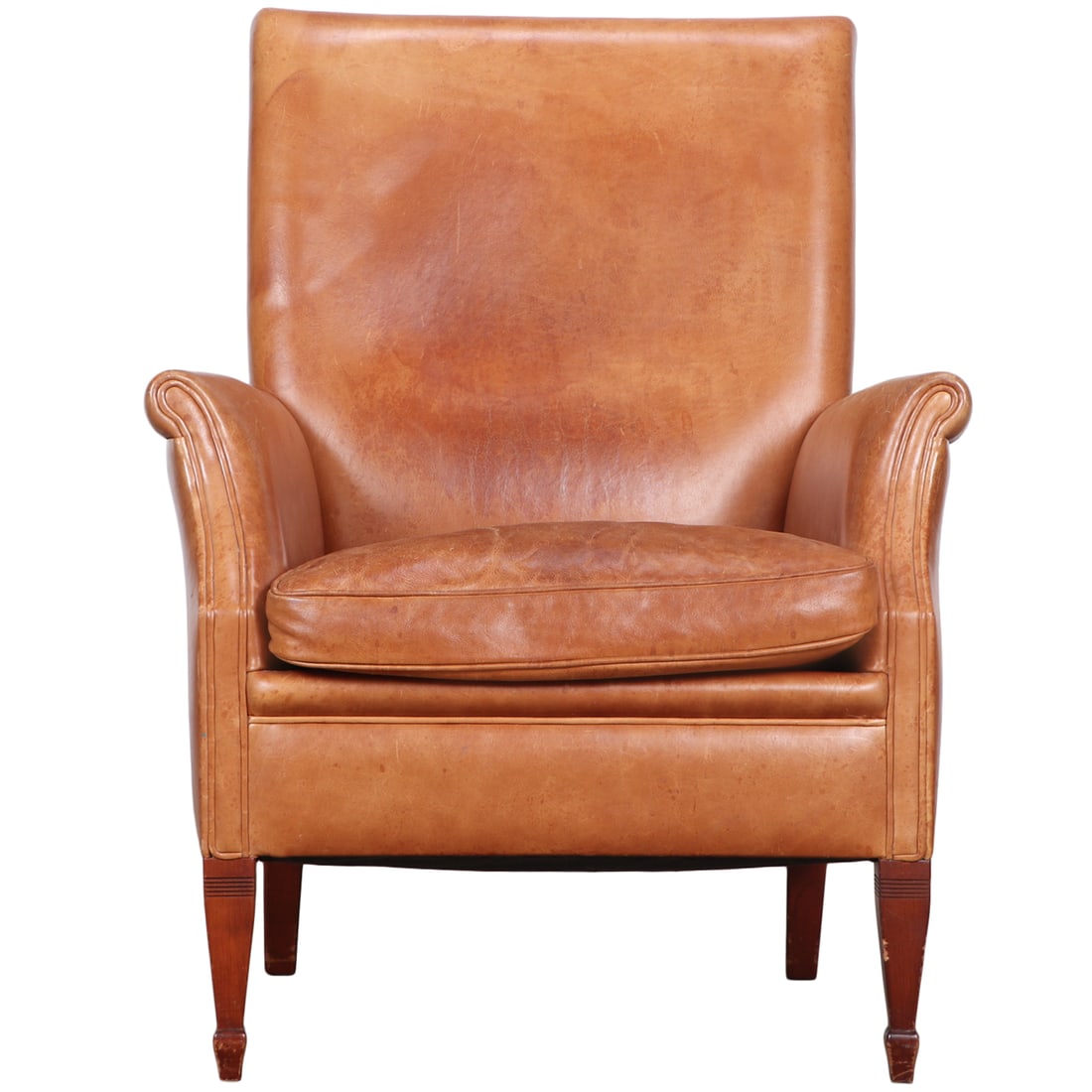 DUTCH LEATHER LOUNGE CHAIR RESTING ON TAPERED FEET.: Dutch leather lounge chair resting on tapered feet. Ht: 39.5" Wd: 29.75" Dpth: 32" Seat: 19"