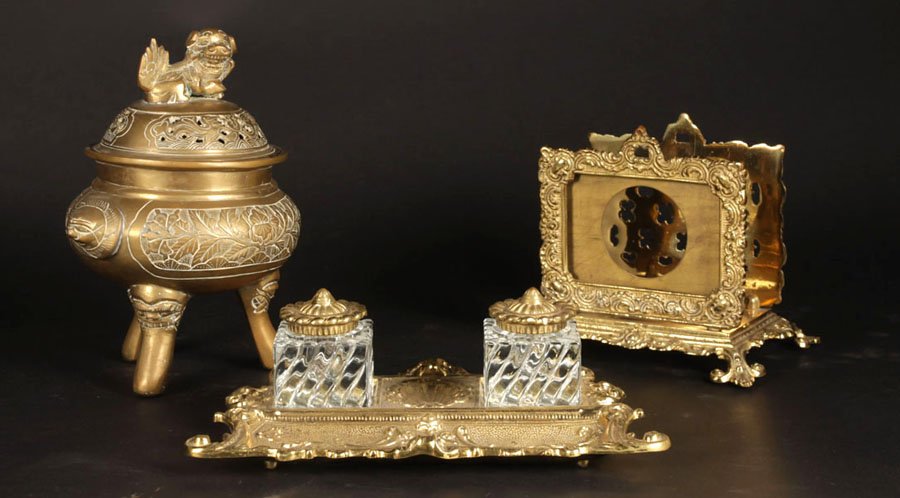 3 PIECE LOT OF BRASS TABLE ITEMS: Three piece lot of brass table items including an inkwell, pen rest, letter holder, and Asian incense burner. Ht: 9.5" Width: 8" (largest)