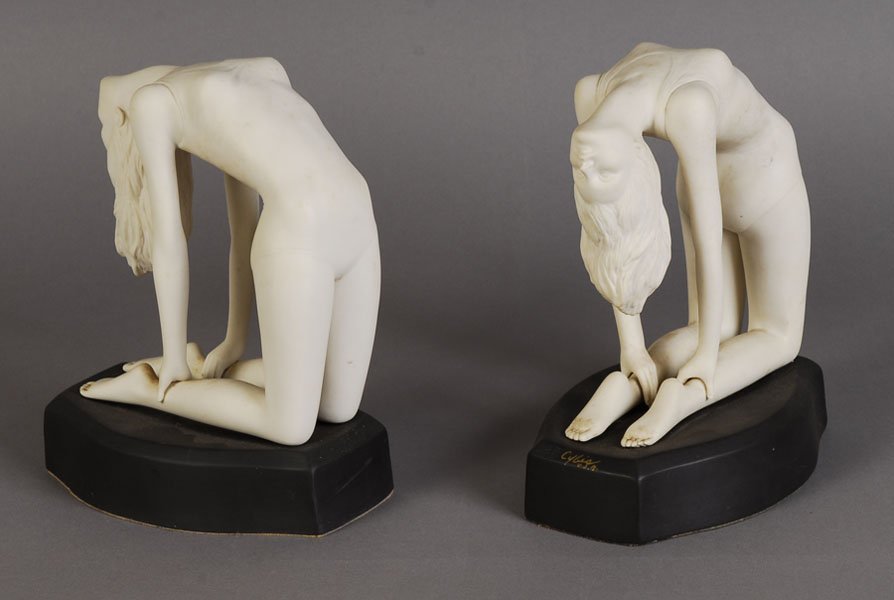 PAIR OF CYBIS ART DECO STYLE BOOKENDS: A pair of Cybis Art Deco style bookends featuring two stretching females. Ht: 9" Width: 7" Depth: 5"