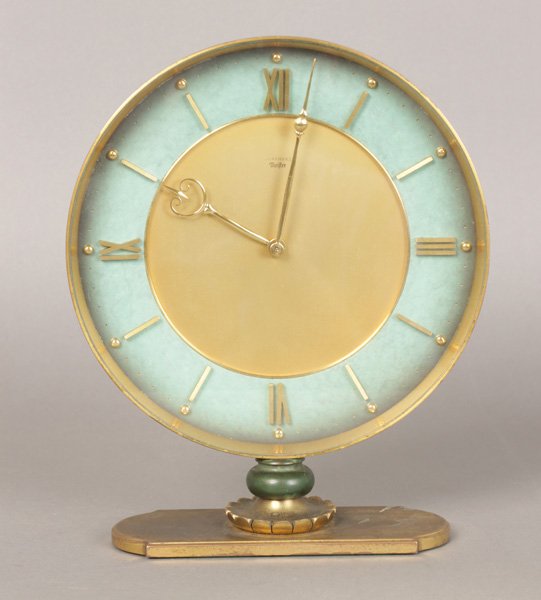 JUNGHAMS MEISTER BRONZE ART DECO CLOCK C. 1950: A good Junghams, Meister bronze Art Deco clock having verdigris decoration on stylized base, circa 1950. Incscrbied on reverse to Raymon Pace Alexander Esq. August 25, 1950 Germany. Ht: 9.75" Width: 8