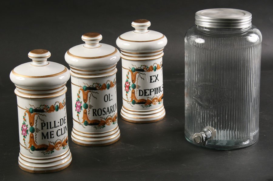 SET 3 PORCELAIN APOTHECARY JARS & GLASS DISPENSER: A set of three porcelain apothecary jars along with a glass drink dispenser. Ht: 11"