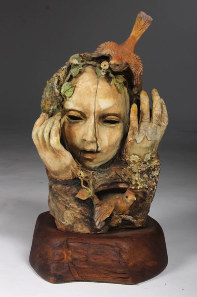 BOLESLAW CYBIS PORCELAIN BUST OF WOOD NYMPH: Boleslaw Cybis (Polish, 1895-1957) Porcelain bust of a "Green Woman" or wood nymph, signed "Cybis A.P." mounted on a burlwood base. 16"H x 9"W x 10"D