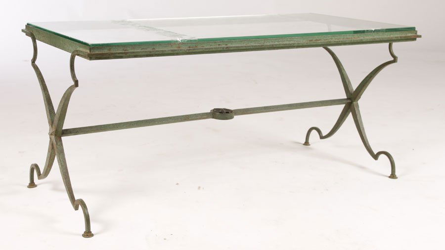 FRENCH ANDRE ARBUS WROUGHT IRON COFFEE TABLE: A very good French Andre Arbus (attr.) painted wrought iron coffee table having inset glass top circa 1940. Supported on highly stylized legs with star decorated cross stretcher. Ht: 15" Width: 32" De