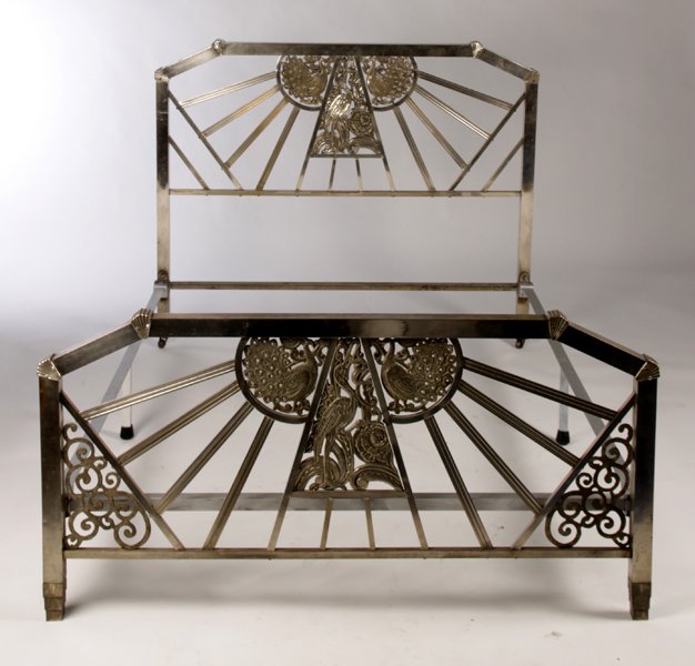 NICKEL OVER BRONZE ART DECO BED PEACOCK CRANE: A nickel over bronze Art Deco bed having stylized cast peacock and crane decorated central panels framed by sun rays circa 1930. Ht: 46" Width: 55"