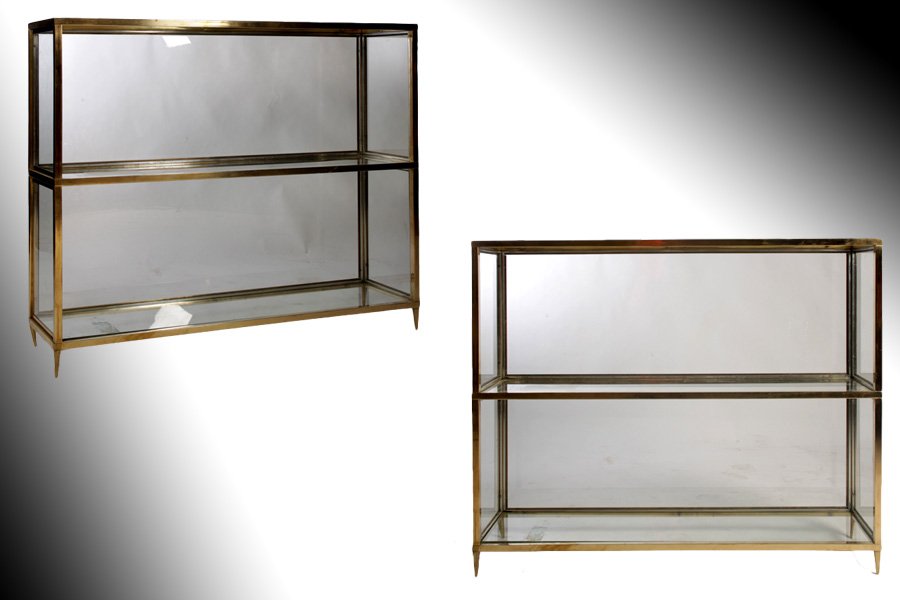 PAIR OF MID CENTURY MODERN BRASS & GLASS ETEGERES: A near pair of Mid Century Modern brass and glass etegeres having glass backs, sides, and shelves circa 1970. Ht: 35.75" Width: 47" Depth: 12" Ht: 35.75" Width: 43.25" Depth: 12" (slightly smaller one