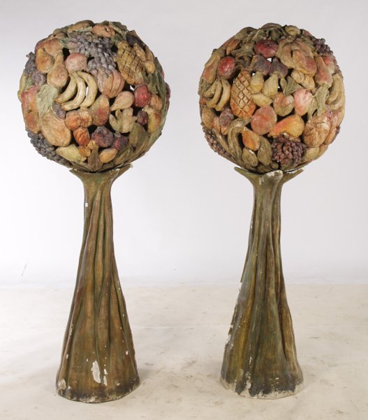 PR. PLASTER MULTICOLORED ARCH. FRUIT SPHERES: A very interesting pair of plaster multicolored architectural fruit spheres supported on faux bois style tapered pedestals. Ht: 66" Dia: 25"