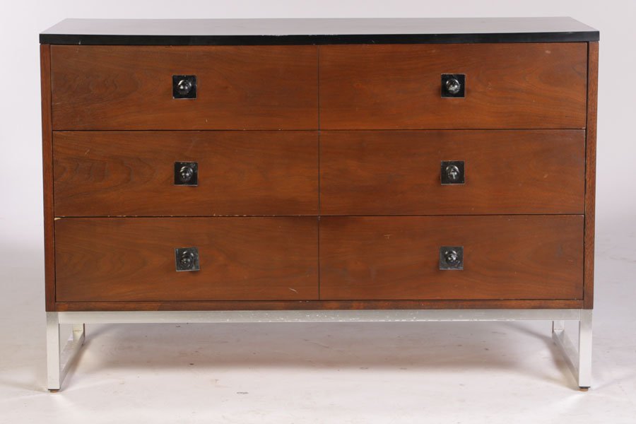 MODERN CHEST OF DRAWERS LABELED THOMASVILLE: A mid century modern chest of drawers labeled Thomasville with black top over three drawers, all raised on chrome base circa 1967. Ht: 30.5" Width: 46" Depth: 18"