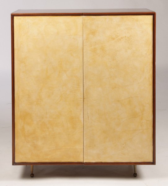 2 DOOR ITALIAN PARCHMENT COVERED BAR CABINET: A two door Italian parchment covered bar cabinet resting on bronze legs in the style of Gio Ponti circa 1940. Dimensions: Ht: 37.75" Width: 31.5" Depth: 14"
