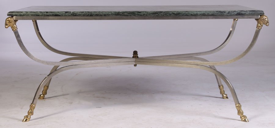 EUROPEAN STYLE RAM'S HEAD COFFEE TABLE MARBLE TOP: Jansen style bronze and steel coffee table having marble top supported on ram's head decorated downswept legs with hoof feet. Ht: 18" Width: 41" Depth: 22"