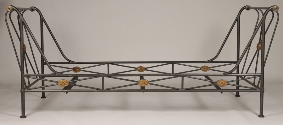 NEOCLASSICAL STYLE WROUGHT IRON DAYBED: A neoclassical iron daybed in the manner of Jansen having cast roundel decoration. Ht: 36" Width: 89" Depth: 38"