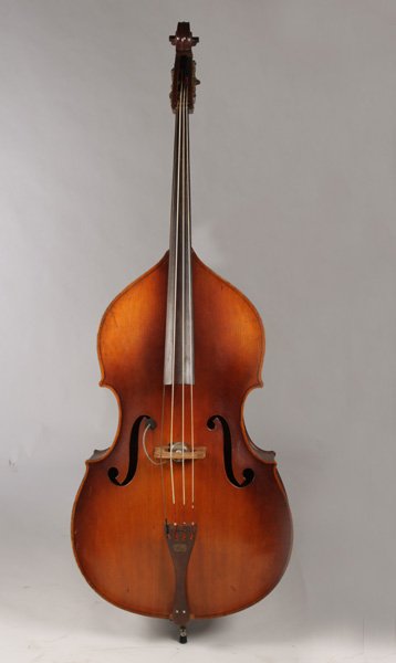 LABELED KAY STANDUP BASE FIDDLE CANVAS COVER: A labeled 'Kay' standup base fiddle with canvas cover. Ht: 76.5" Width: 26.5"