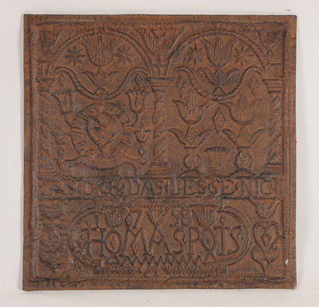 CASTIRON FIREBACK IN THE PENNSYLVANIA DUTCH STYLE: A cast iron fireback in the Pennsylvania Dutch style. Ht: 22.5" Width: 22.5"