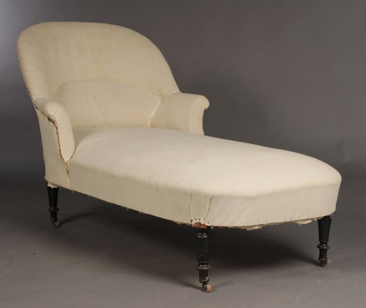 NAPOLEON III CHAISE LOUNGE ARCHED BACK ROLLED ARM: A Napoleon III chaise lounge having arched back and slightly rolled arms raised on turned legs circa 1880. Ht: 34" Width: 30" Depth: 54"