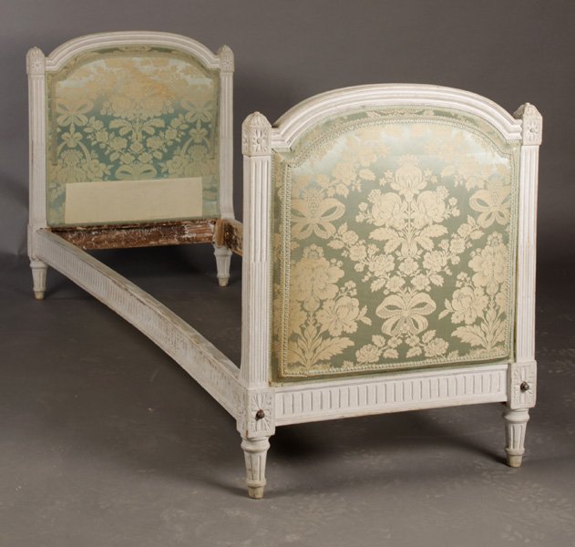 LOUIS XVI CARVED PAINTED DAYBED UPHOLSTERED ENDS: A Louis XVI style carved and painted daybed having upholstered ends framed by fluted columns circa 1910. Ht: 35.5" Depth: 28"