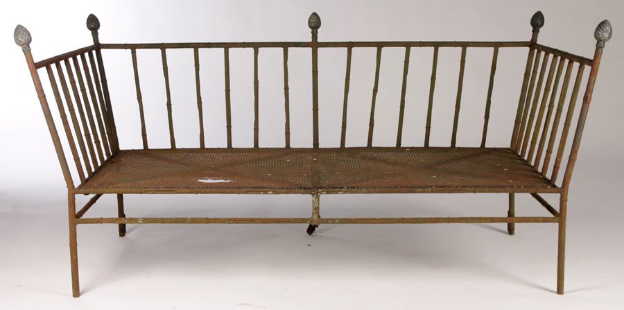 STYLISH IRON FAUX BAMBOO GARDEN SETTEE PINEAPPLE: A stylish iron faux bamboo garden settee having pineapple finials circa 1970. Ht: 31.5" Width: 65" Depth: 31"